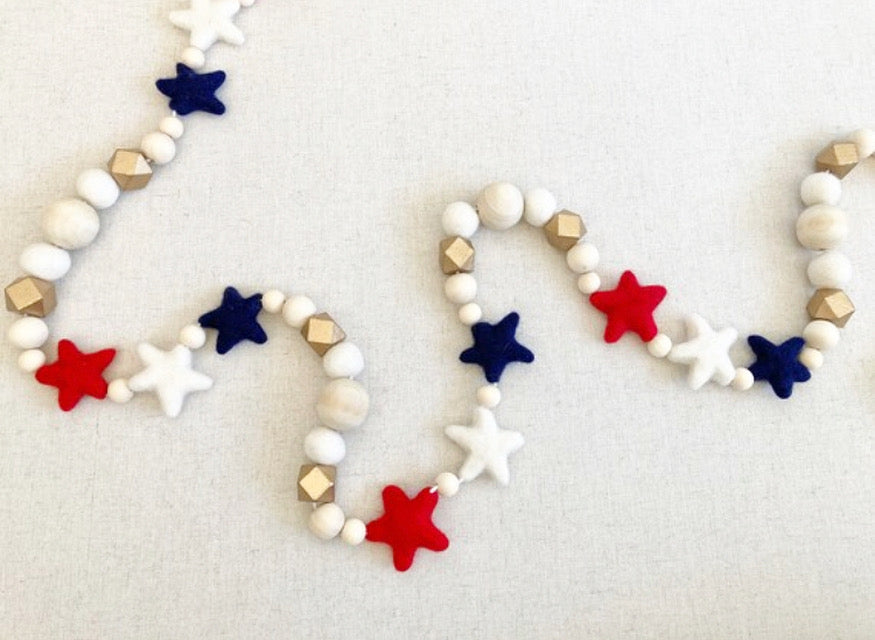 Red, White and Blue felt stars with gold garland. 5ft