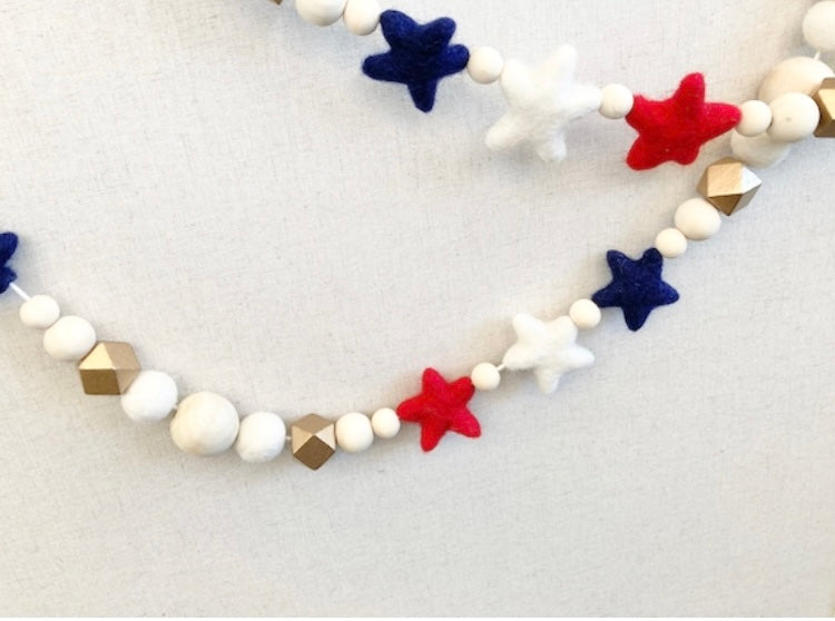 Red, White and Blue felt stars with gold garland. 5ft